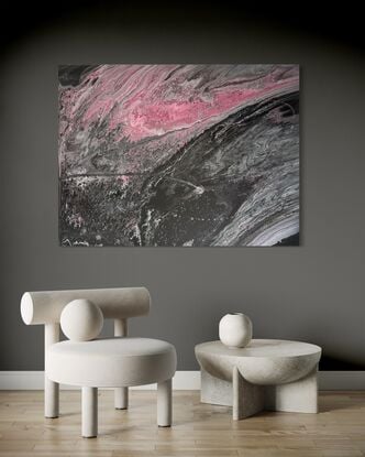 A fluid art painting featuring swirling patterns of black, grey, and pink acrylic paint on canvas. The composition resembles a flowing, abstract landscape with a dynamic contrast between dark and light tones, evoking a sense of movement and depth.