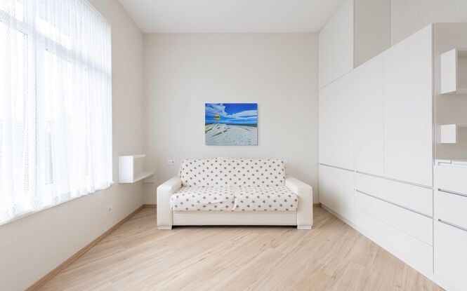 Seascape oil painting of the view of Semaphore beach with the yellow lifeguard tower. The sand is rippled and the ocean is in the background.