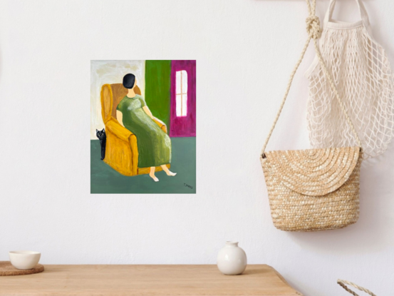 Interior abstract style painting of a lady or woman with short black hair with no features on her face, wearing a long green dress sitting in an ochre coloured wingback chair. There is a black cat peeking around from the back of the armchair. The walls behind alternate from creamy white to green to magenta. There is a white window in the magenta wall. The lady has bare feet. The floor is a  grey green colour. 