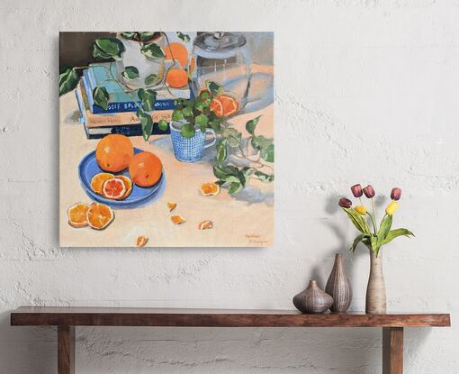 Composition with cooking books, plants, tableware and oranges