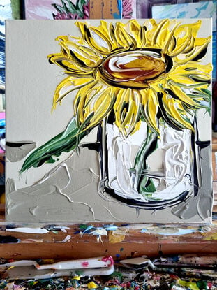 Single sunflower on beige