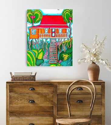 This artwork just oozes tropical vibes. Vibrant, bright and colourful, this piece is a quirky take on the iconic Queenslander home on stilts. Featuring long exaggerated entry stairs, an orange coloured home, stilts that seem to sway in the breeze and an abundance of lush green tropical plants and foliage, this painting is all about colour and fun. Blue skies and palm trees complete the look.
It would brighten any home or workplace and add the ultimate pop of colour and joy. 