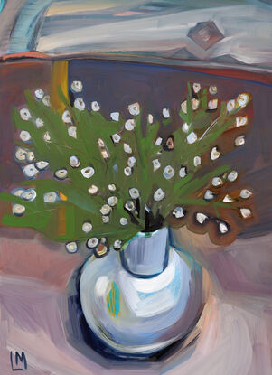 A bouquet of small white flowers in the white vase, view from above 