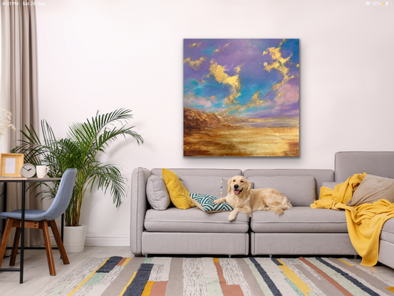 Large blue purple sky with gold leaf cliffs and clouds, ocean, sands