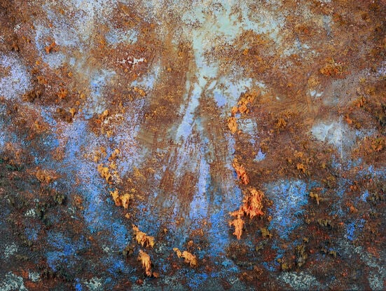 This abstract contemporary painting is a dynamic representation of nature, dominated by vibrant  blue hues and complemented by orange tones. The artist employs a heavy texture, adding depth and dimension to the artwork, creating a visually engaging and evocative piece.