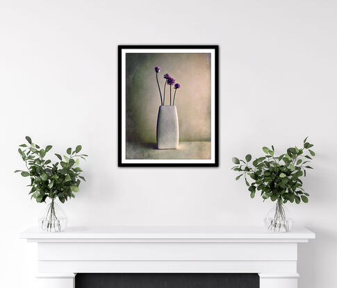 Four Chive flower stems in a crackled white vase.  Minimal.