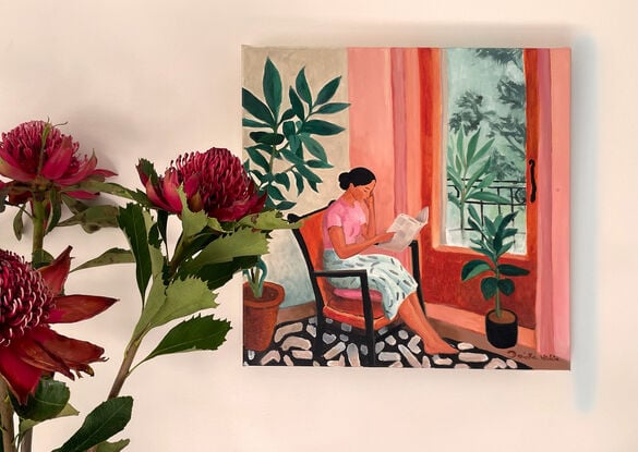 We see a woman sitting on an old chair and a pillow, near a window. It's an interior painting with a figure in it. She is reading. The room seems quiet. Through the window we glimpse tree branches and leaves. She is kept company by two healthy plants. 