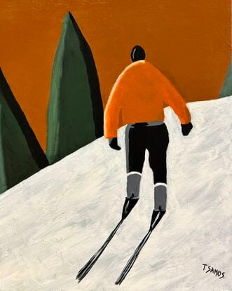 A lone male skier is view from behind. He is wearing an orange jackets and black pants and ski boots. He is trekking up the white snow hill towards some green conifers in the distance. The sky above is a warm orangey brown colour. 