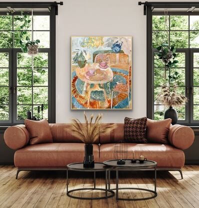 Living room scene with round table, patterned fabric chairs, gold chandelier 