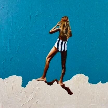 Tanned girl in blue and white striped bathers on white cliff with turquoise background 