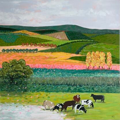 Cows grazing in a brightly coloured landscape.