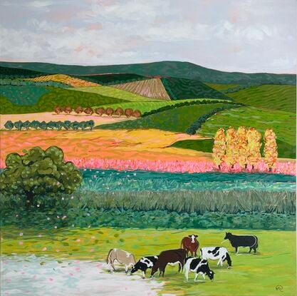 Cows grazing in a brightly coloured landscape.