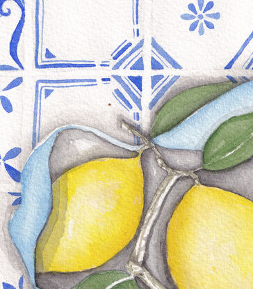 Lemons resting in a cloth waiting on a tiled table