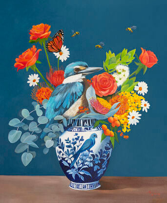 Sacred Kingfisher perched on a chinoserie vase filled with flowers. 