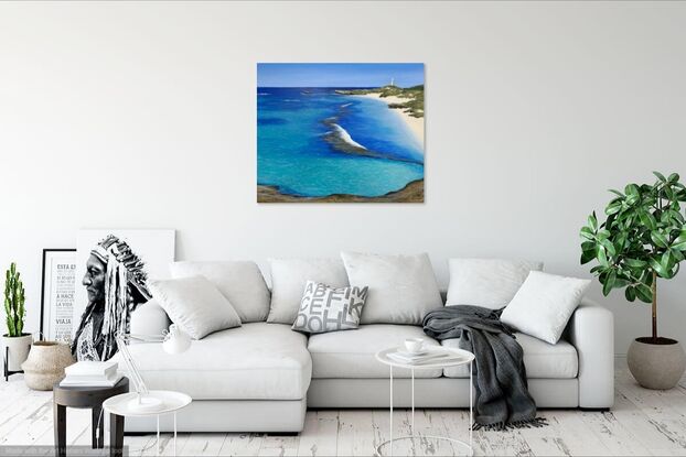 This artwork predominately reflects the blue and turquoise waters of Rottnest Island with Bathurst Lighthouse, rocks, sand and greenery in the background. The primary colours are turquoise, blue, yellow and brown and the ripples in the sand and water are light yellow and pale blue. 