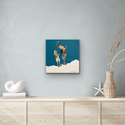 Boy with surfboard in front of a white cliff over blue water