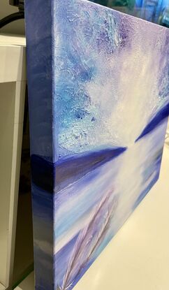 This atmospheric Mystical seascape impressionistic  painting captures the essence of the ocean with a minimalistic approach. Using a palette of purple, blue, white, aquamarine, royal blue, and black, the artist masterfully blends colours with a palette knife and soft brush to create a textured surface that evokes a sense of tranquility and depth. Perfect for a bedroom, this piece comes with a certificate of authenticity and is ready to hang with all sides painted and gallery wrapped, making it a versatile addition to any space. Transport yourself to the serene beauty of the sea with this captivating artwork.