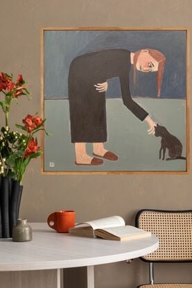 The painting depicts a woman bending over to pat a black cat. 