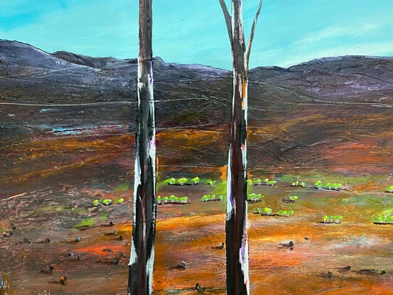 Beacons of hope is a Colourful textured abstract landscape with soft blue sky and vibrant colourful earthy countryside with three trees in the foreground.