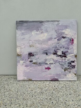 Layers of pink, purple and white paint with lashings of metallic gold paint. 