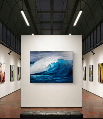 Powerful large wave with tones of blue,  an  iridescent focal point which draws in the viewer's eye. 