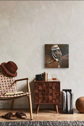 A kookaburra painted with paint tones of brown and beige depicting true Australiana.