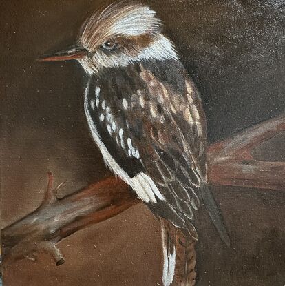 A kookaburra painted with paint tones of brown and beige depicting true Australiana.