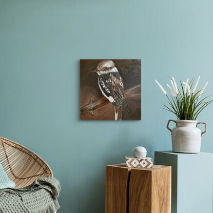 A kookaburra painted with paint tones of brown and beige depicting true Australiana.