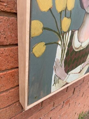 The painting depicts the head and shoulders of a girl. There is a brown bird on one shoulder of the girl. The girl is holding yellow flowers. The background is blue. 