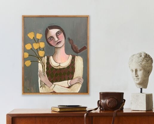 The painting depicts the head and shoulders of a girl. There is a brown bird on one shoulder of the girl. The girl is holding yellow flowers. The background is blue. 