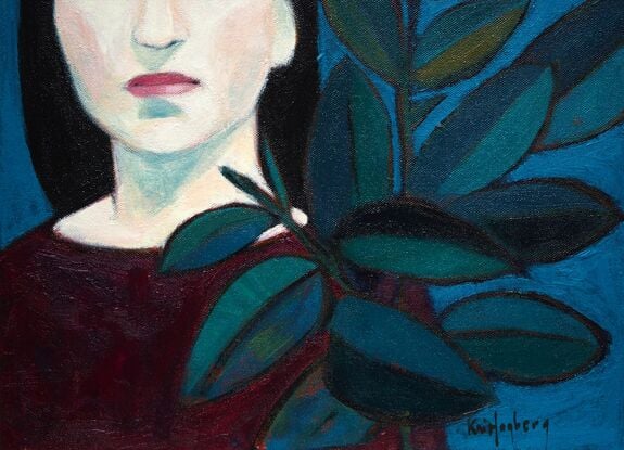 Woman in dark red  next to a ficus