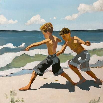 Two boys playing on the beach