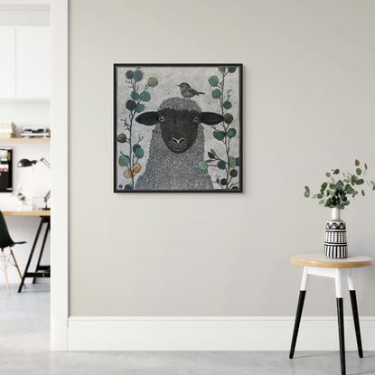 A framed  limited edition print of my mixed media drawing of a Sheep and a Little Bird amongst eucalyptus on 360 gsm pastel paper, rendered in coloured pencil and oil pastel