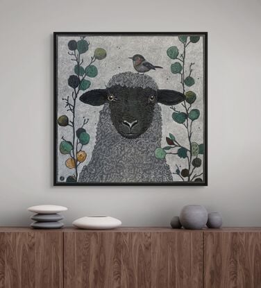 A framed  limited edition print of my mixed media drawing of a Sheep and a Little Bird amongst eucalyptus on 360 gsm pastel paper, rendered in coloured pencil and oil pastel