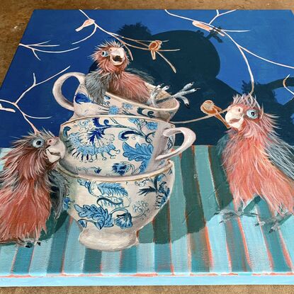 Baby galahs laughing with patterned teacups