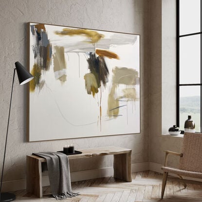 bold paint and pencil marks in light ochre with areas of white and grey, beige, tan, and navy blue expressive marks across a large canvas