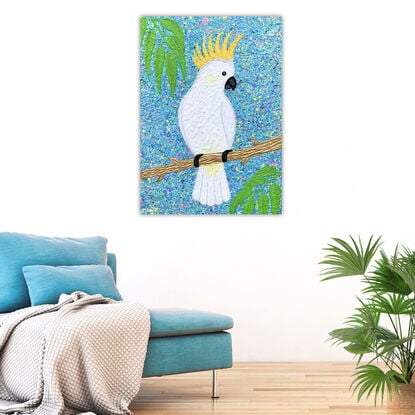 sulphur crested cockatoo on a golden branch and blue skies textured abstract