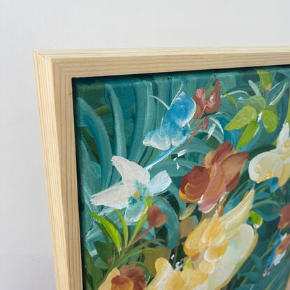 small colourful tropical flower painting framed in a natural frame