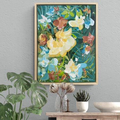 small colourful tropical flower painting framed in a natural frame