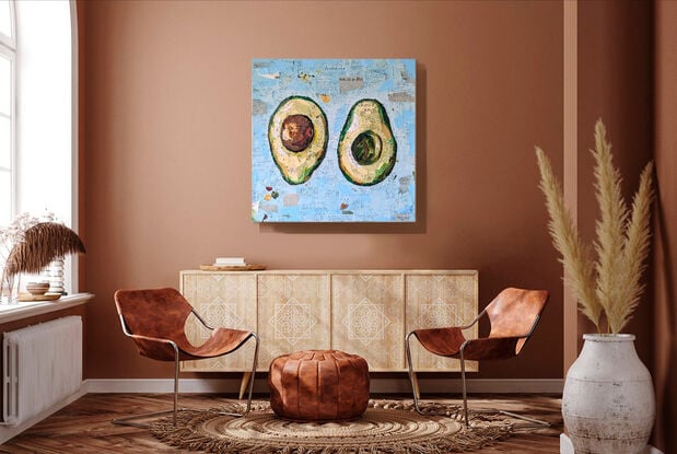 Collaged mixed media painting of an avocado cut in half