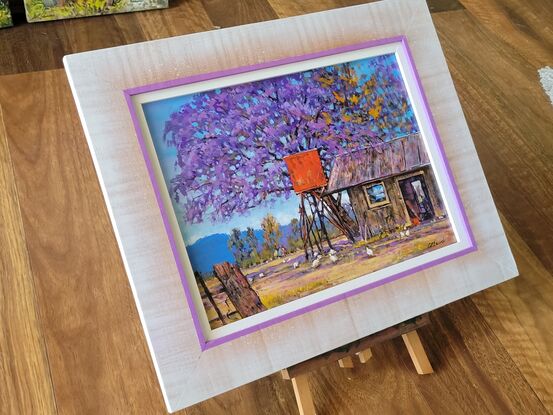 Inspired by a local rural scene with a bright red fuel tank, beside the old shed,.. chooks scratching around under the big old Jacaranda Tree, a lovely colourful rural scene, framed and ready to hang 