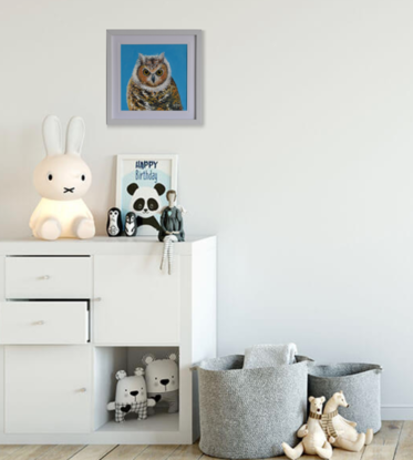 Framed painting of a barn owl on a blue background