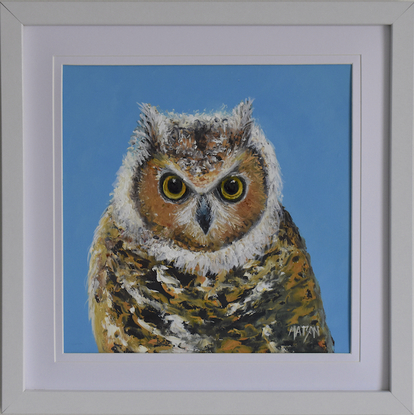 Framed painting of a barn owl on a blue background