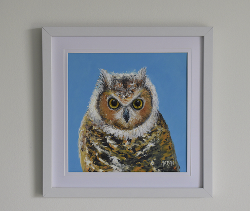 Framed painting of a barn owl on a blue background