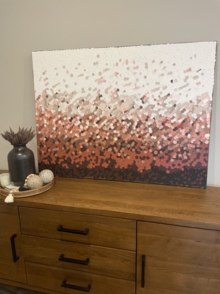 Inspired from colours from Uluru australia, this painting is done with textured dots in rust, brown, peach and white tones