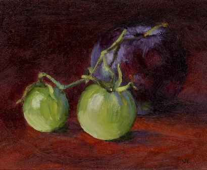 Still life of dark plum with green cherry tomatoes