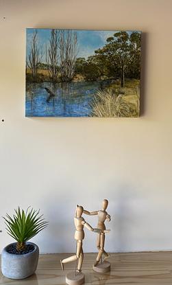 An impressionistic view of the trees, grasses and water  of the Thredbo River. 