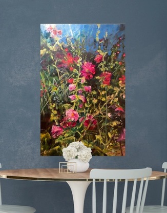 Horizontal painting of  red Hollyhock  flowers and old fashioned rose buds and a blue pond.   In a garden setting with  glimpses of a pond and a dark background