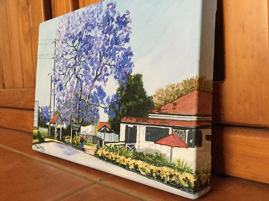 local scene of cafe with jacaranda tree