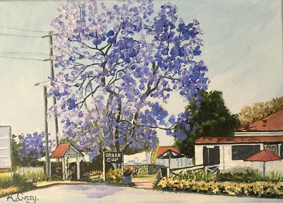 local scene of cafe with jacaranda tree